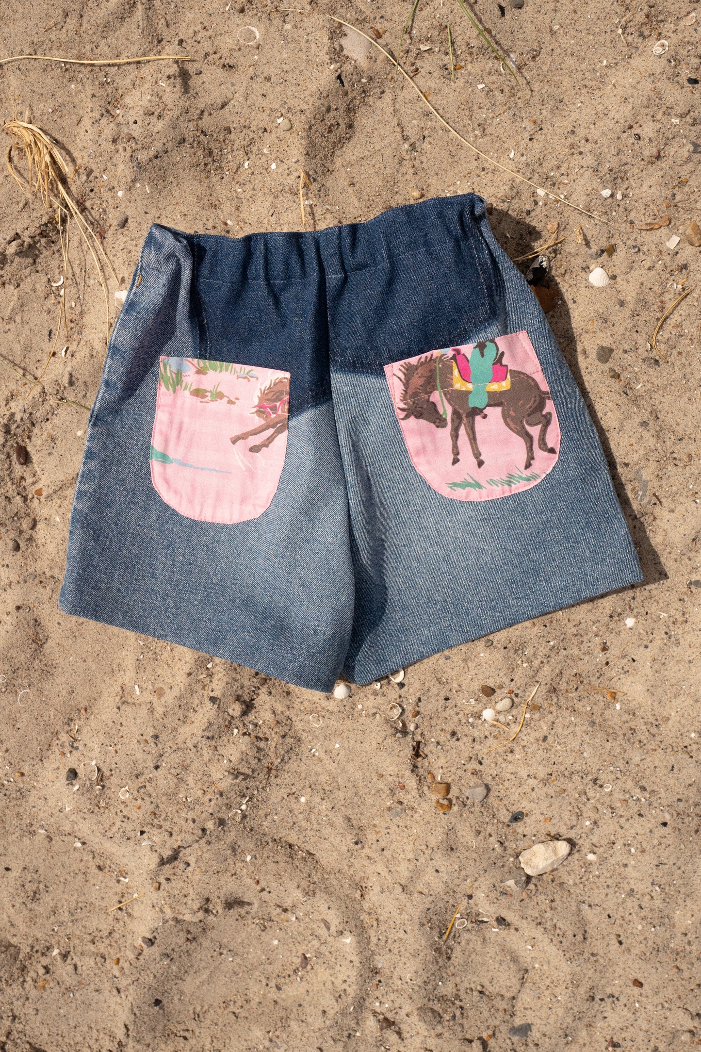 BOBBIE SHORTS, UPCYCLED BLUE DENIM, PINK HORSE COWBOY POCKETS